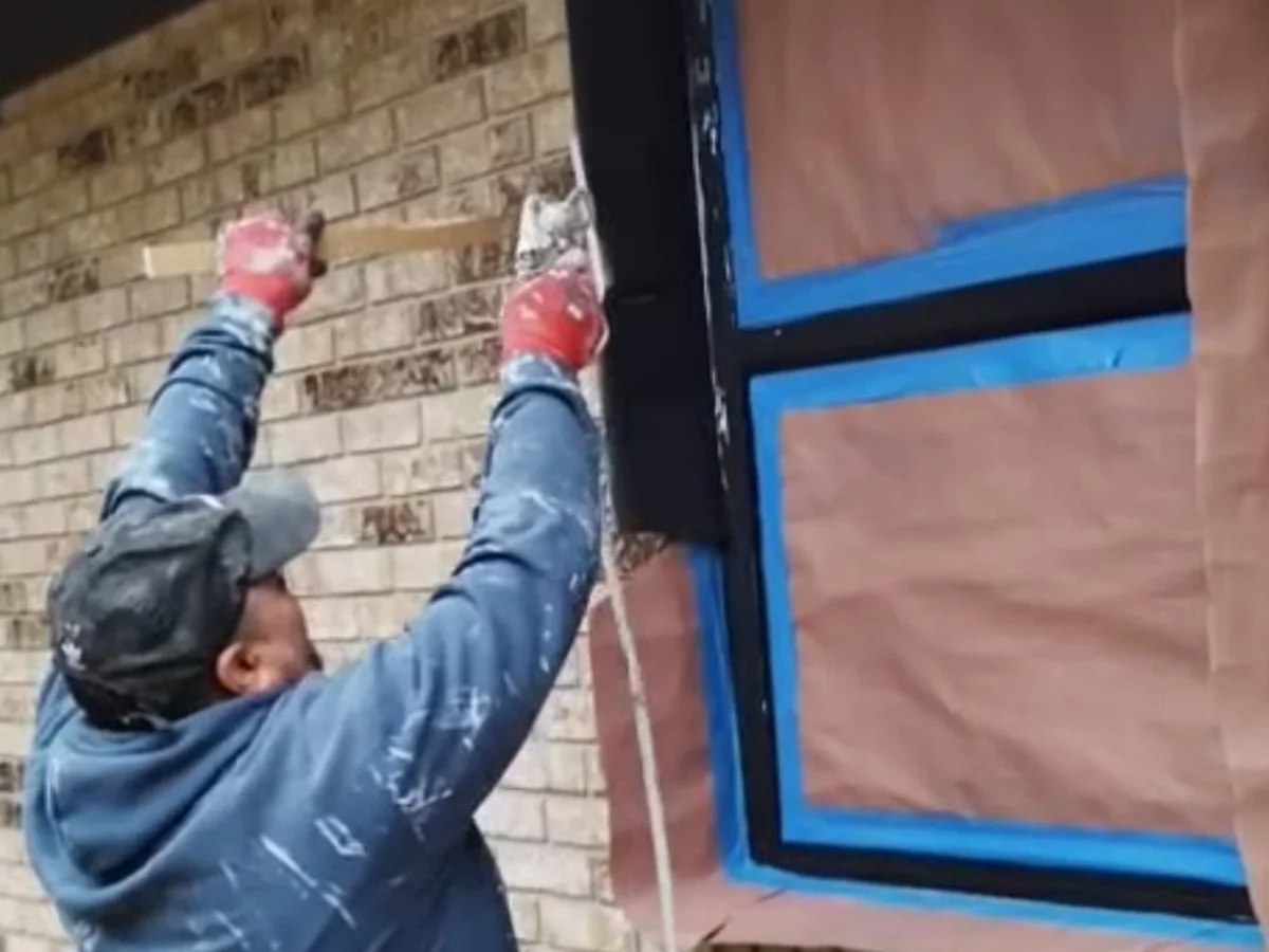 Painting exterior brick with the windows masked