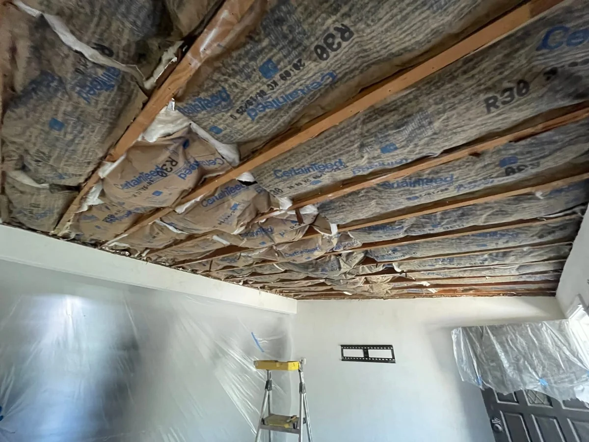 Ceiling opened to the joists for a full drywall repair